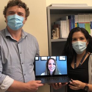 masks and virtual meeting on laptop