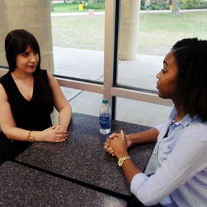 Students at a table having conversation