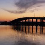 bridge over water at dusk