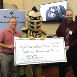 Knightro holding check with recipients