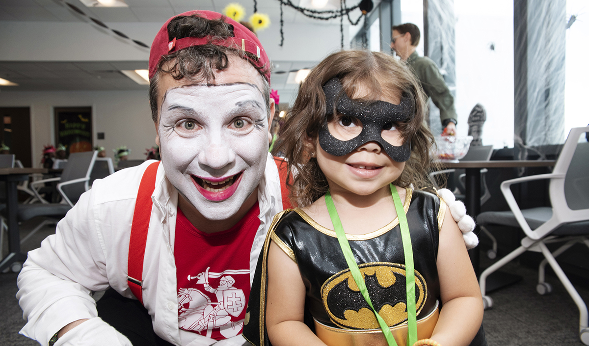 child and faculty in costume