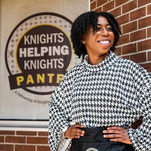 Naseeka Dixon in front of Knights Pantry