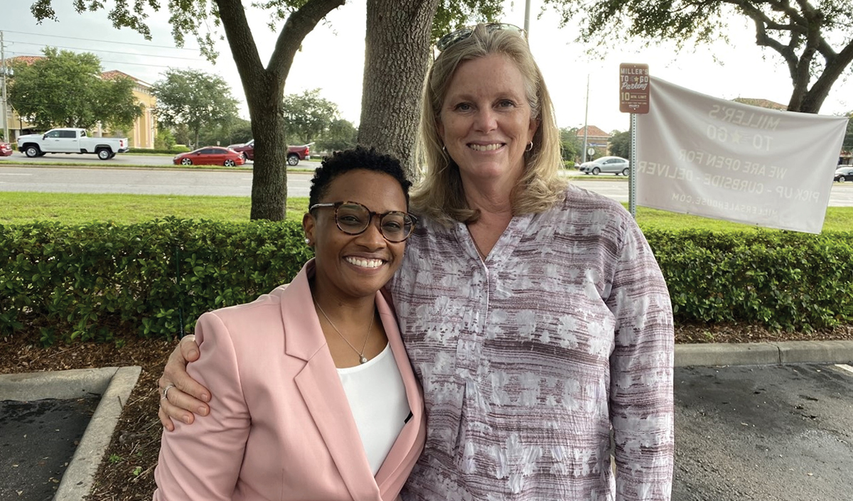 Whitney Hanley standing with UCF exceptional education professor Rebecca HInes