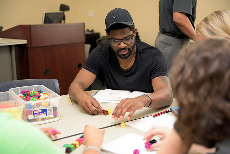 UCF teacher education student working with math manipulatives