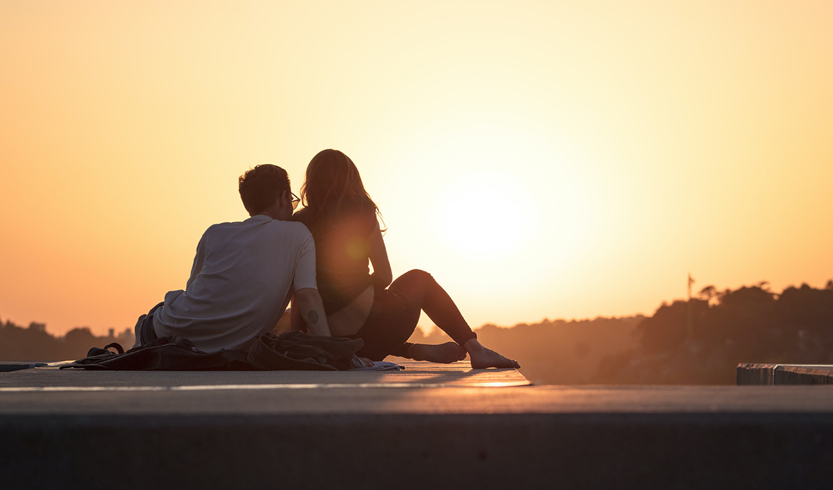 Couple looking out over horizon