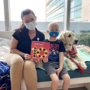 UCF PedsAcademy: Reading Aloud to Therapy Dogs Helps Patients, Young Readers Build Confidence