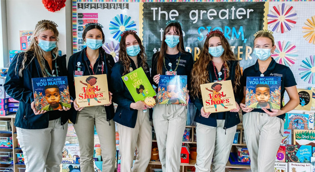 students holding books for read across america