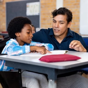 UCF student working with child in classroom