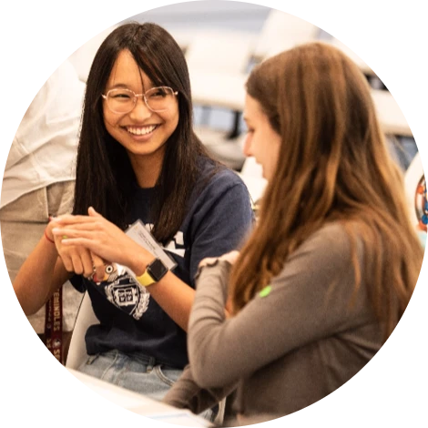 Two female students conversing