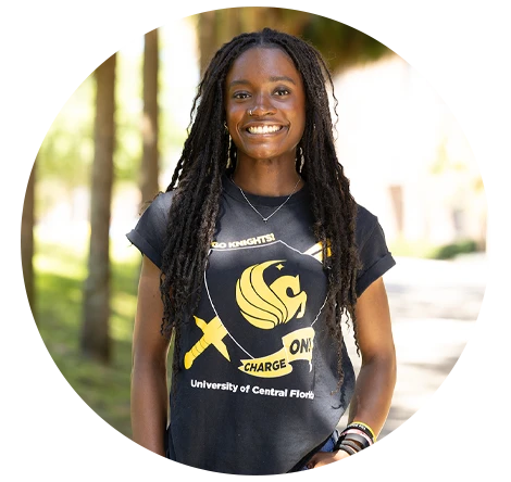 Female UCF student smiling and wearing a UCF T-shirt