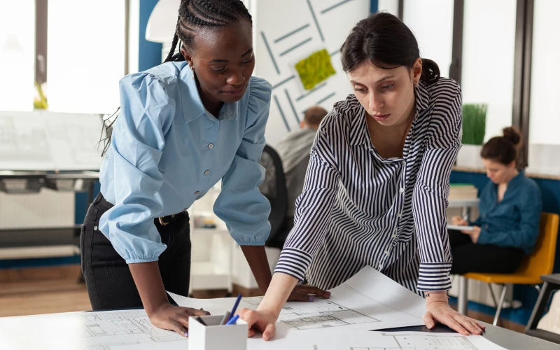 Urban planners reviewing drafts