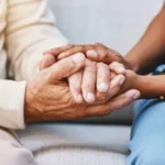 hands holding in comfort