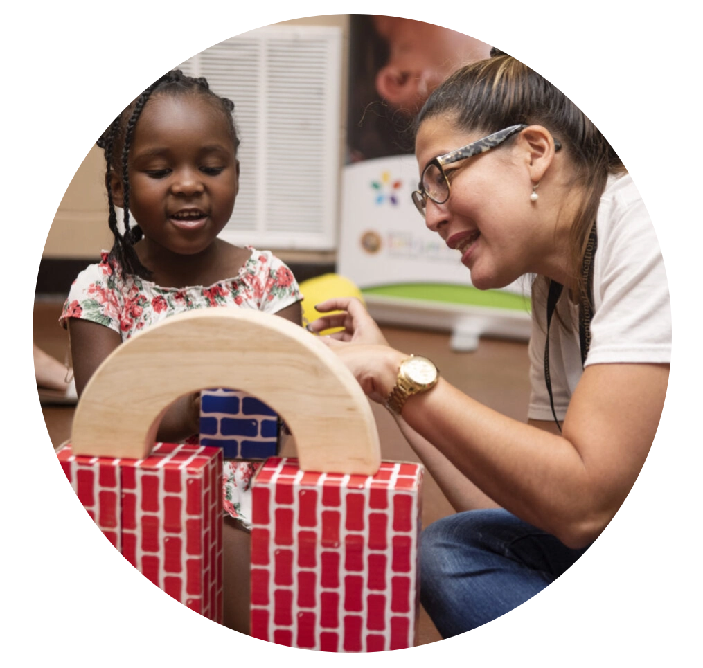 Female teacher doing educational activity with child