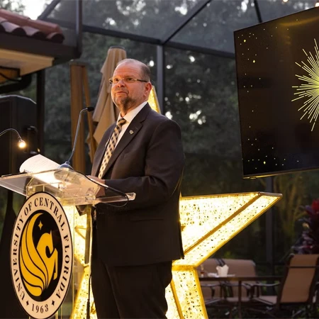 UCF President Alexander N. Cartwright speaking at the 2025 Luminary Awards
