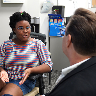 Student speaking with counselor