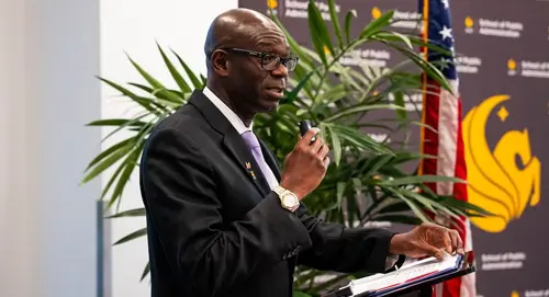 Abdul-Akeem Sadiq speaking at an event at UCF Downtown.