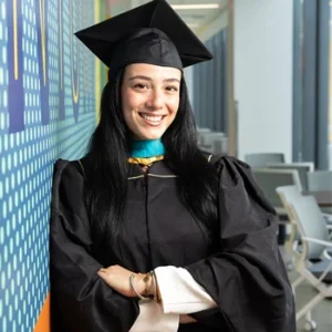 Young femaile graduate in cap and gown