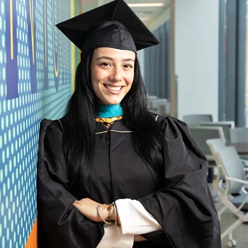 Young femaile graduate in cap and gown